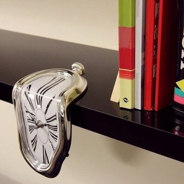 Inspired by famous Salvador Dalí painting "The Persistence of Memory" the Melting Clock was designed to be used on a shelf or hanging on your office desk.
