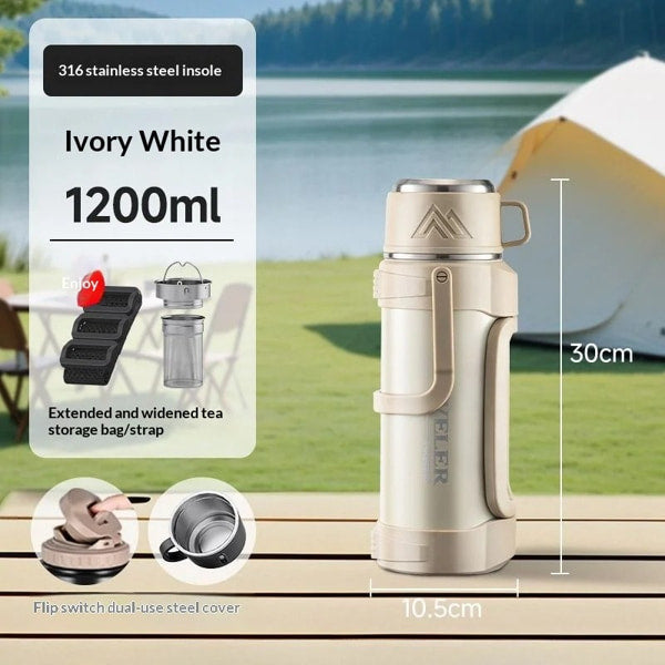 Portable vacuum flask with ergonomic handle and one touch opening lid