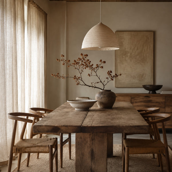 Natural wood dining room with soft linen curtains