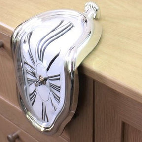 Inspired by famous Salvador Dalí painting "The Persistence of Memory" the Melting Clock was designed to be used on a shelf or hanging on your office desk.