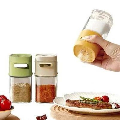 Quantitative salt shaker with push button dispenser