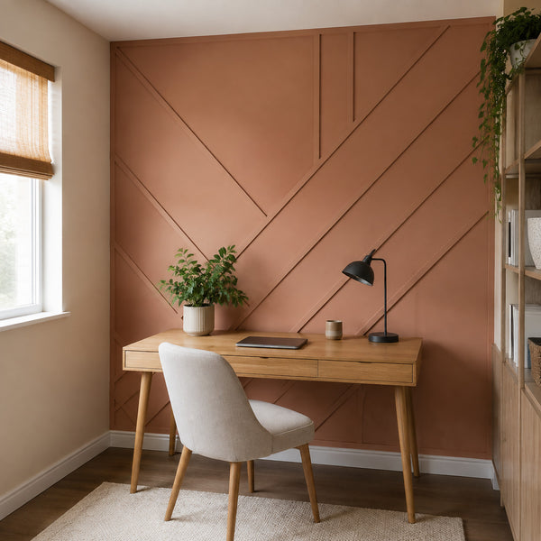 Compact home office with geometric trim accent wall in muted clay