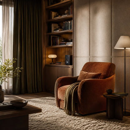 Cozy reading room with acoustic curtains, wool rug and soft seating