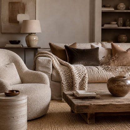 Neutral living room layered with boucle, linen, velvet and wood