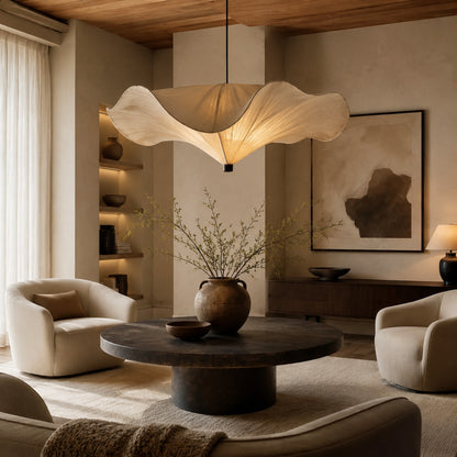 Sophisticated living room anchored by a sculptural pendant light