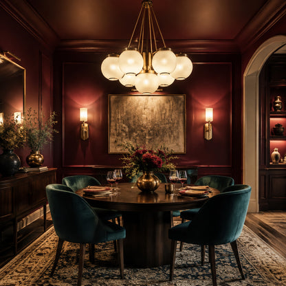 Burgundy dining room with chandelier and wall sconces