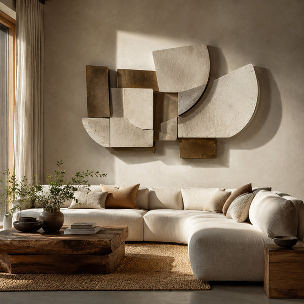 Abstract plaster and aged metal sculpture on a living room wall